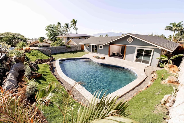 view of swimming pool featuring a patio, a fenced backyard, and a fenced in pool