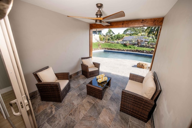 view of patio with outdoor lounge area, a ceiling fan, and an outdoor pool