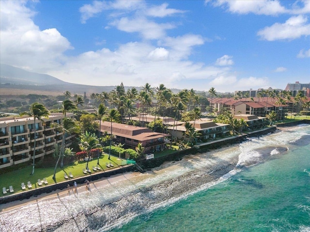 bird's eye view featuring a water view and a view of the beach