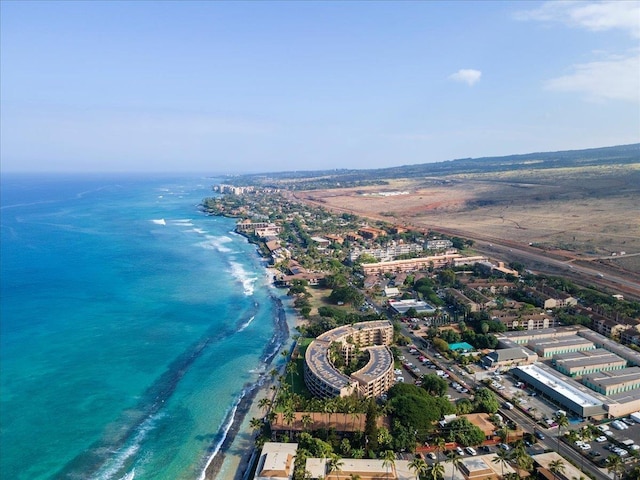 aerial view with a water view and a view of the beach