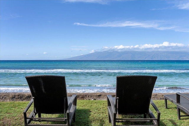 property view of water with a mountain view and a view of the beach