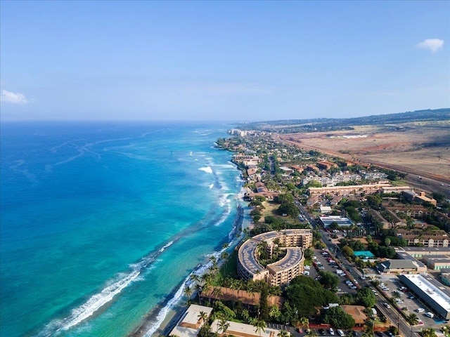 bird's eye view featuring a water view and a view of the beach