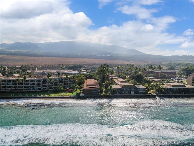 exterior space with a water and mountain view