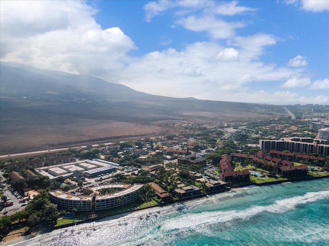 aerial view featuring a water and mountain view