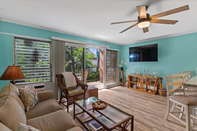 living room featuring ceiling fan and light hardwood / wood-style flooring