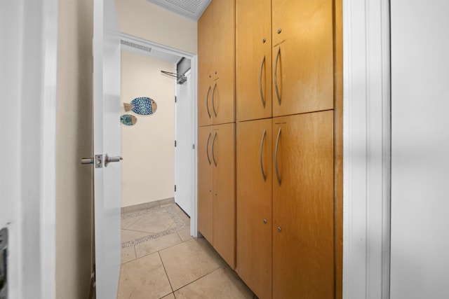 hallway with light tile patterned floors