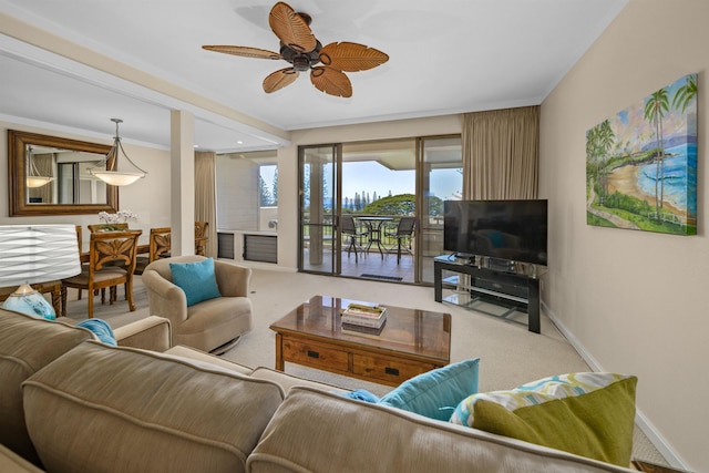 carpeted living room with ceiling fan