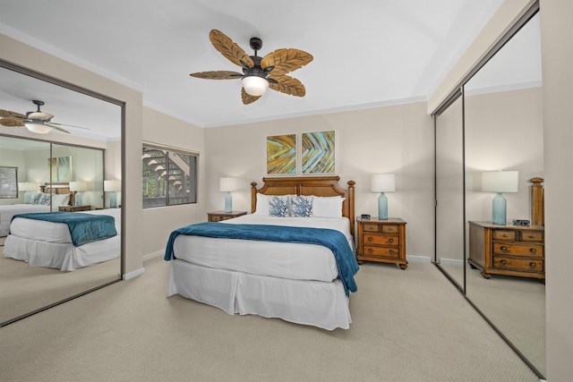 carpeted bedroom with crown molding, ceiling fan, and a closet