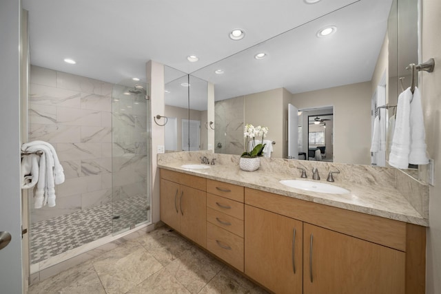 bathroom featuring vanity and tiled shower