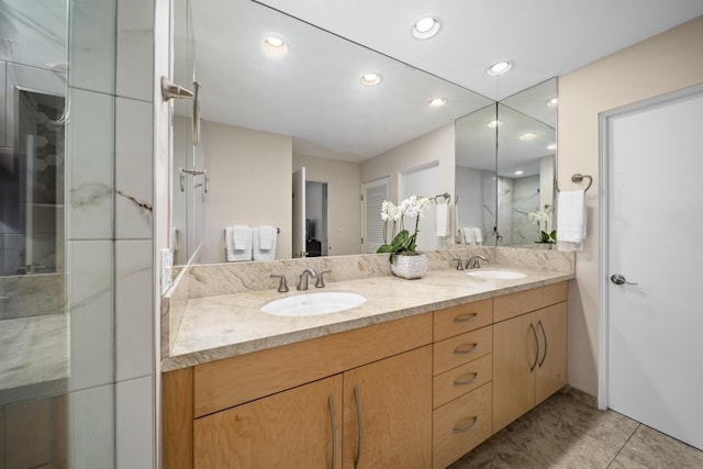 bathroom with vanity, tile patterned flooring, and walk in shower