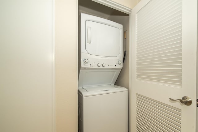 laundry area featuring stacked washer and dryer