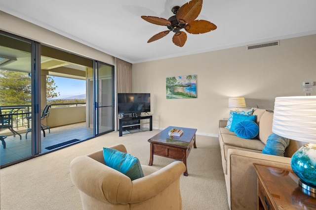 living room with ceiling fan and light carpet