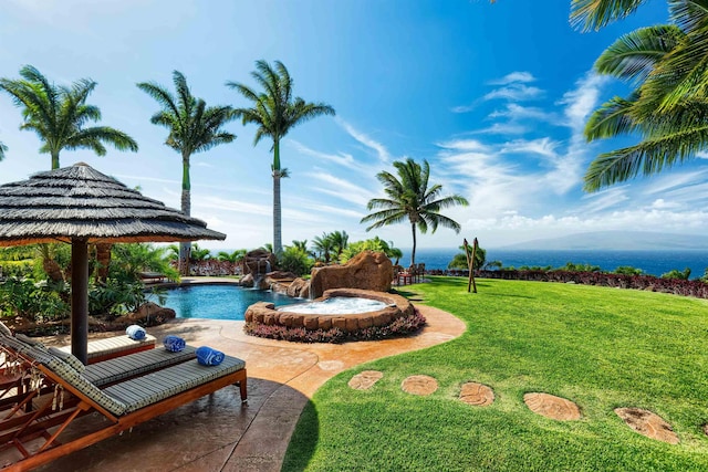 view of swimming pool featuring a yard and a patio area