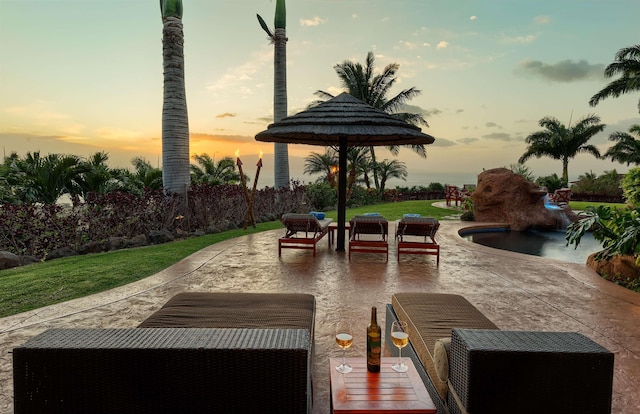 view of patio terrace at dusk