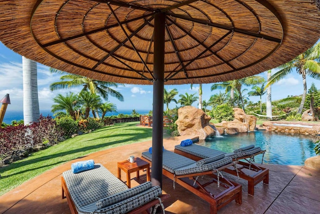 view of patio / terrace with pool water feature