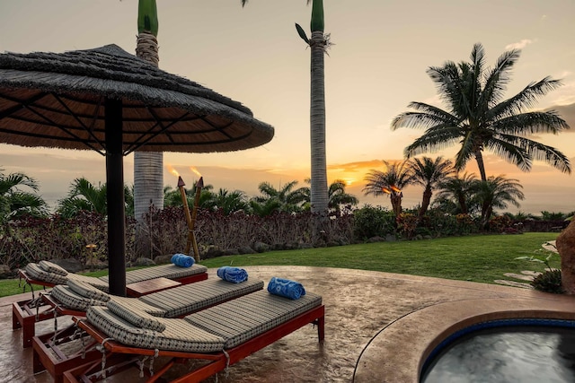 patio terrace at dusk with a lawn