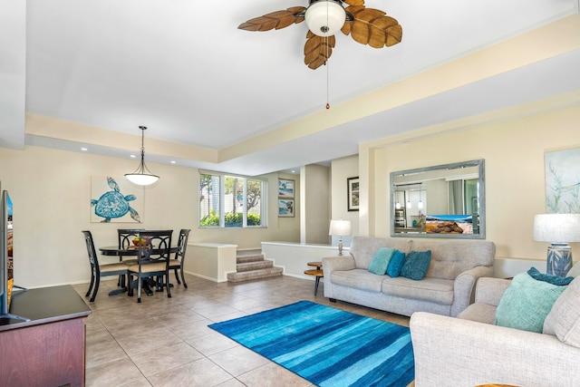 living room with ceiling fan and tile flooring