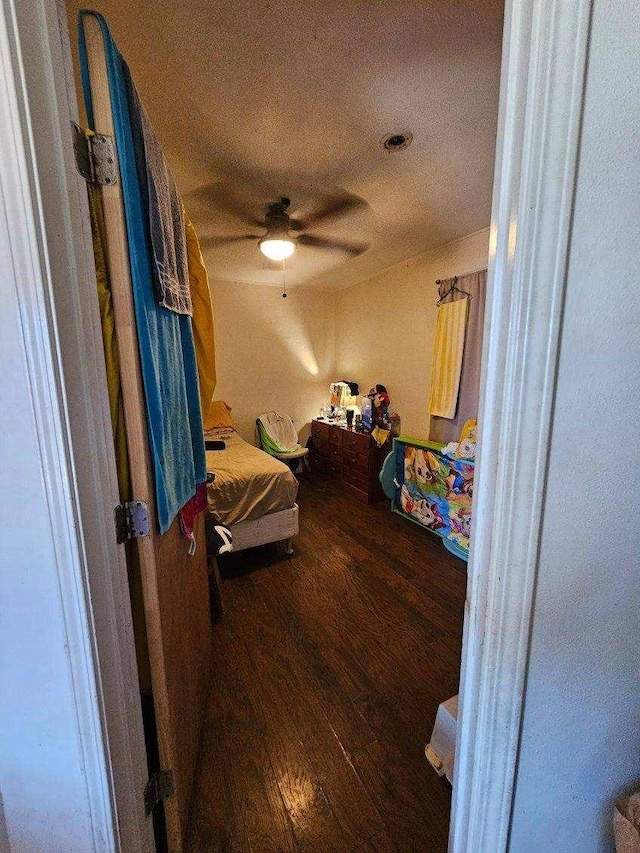 bedroom featuring hardwood / wood-style floors and ceiling fan