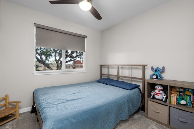 bedroom with carpet, baseboards, and a ceiling fan