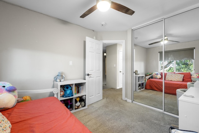 bedroom featuring ceiling fan, carpet floors, and a closet