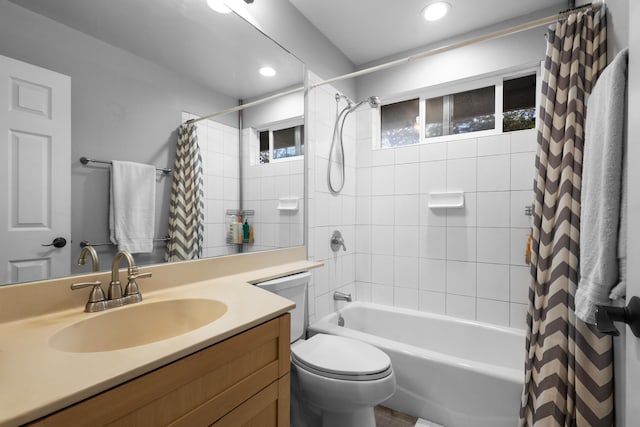 bathroom with toilet, shower / tub combo, vanity, and recessed lighting