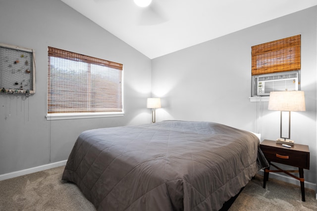 carpeted bedroom with cooling unit, vaulted ceiling, and baseboards