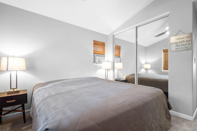 carpeted bedroom featuring lofted ceiling, a closet, cooling unit, and baseboards