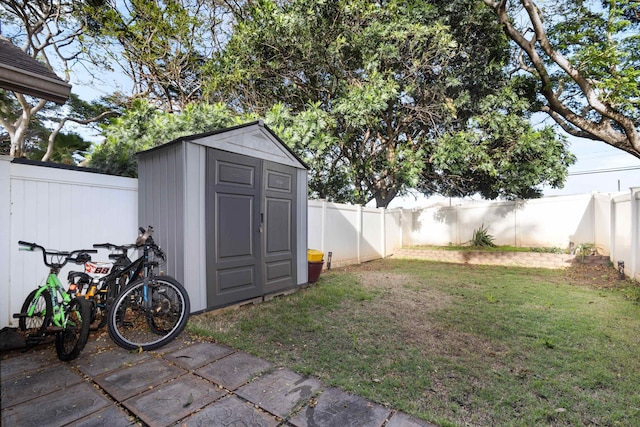 view of shed with a fenced backyard