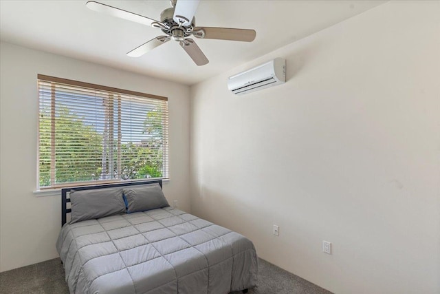 carpeted bedroom featuring ceiling fan and a wall mounted air conditioner