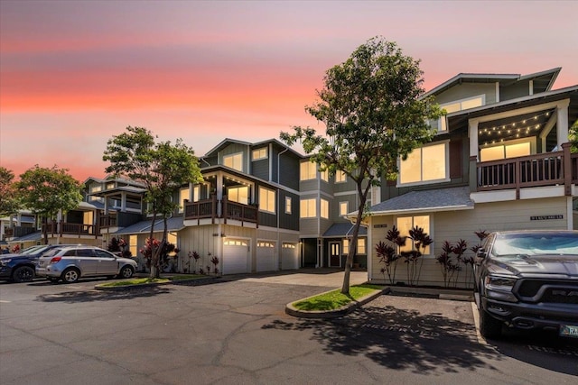 view of front of house with a balcony and a garage