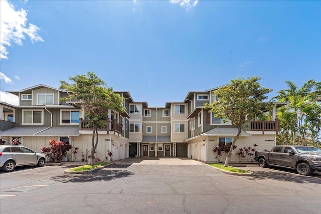 exterior space featuring a balcony and a garage