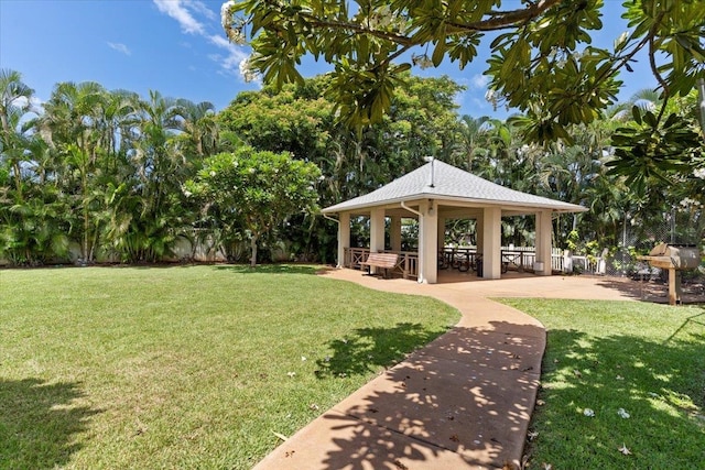 view of property's community with a gazebo and a yard