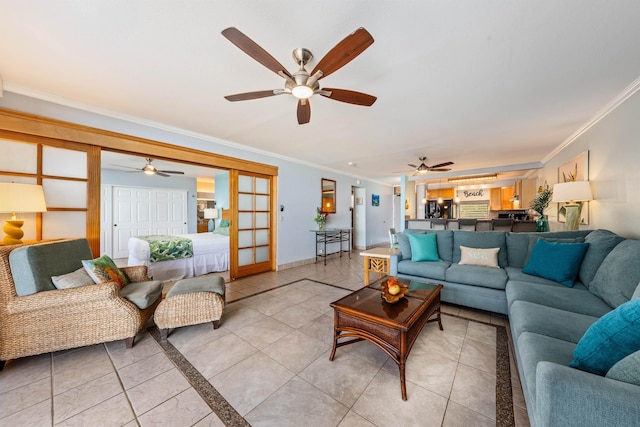 tiled living room featuring french doors and crown molding