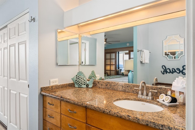 bathroom with ceiling fan and vanity