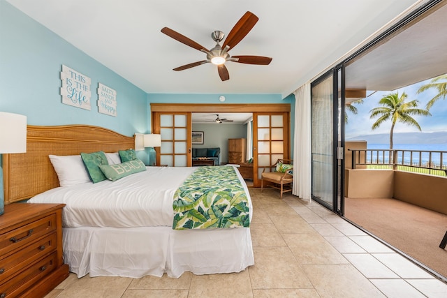 tiled bedroom featuring french doors and ceiling fan