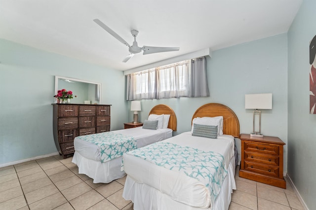 tiled bedroom with ceiling fan