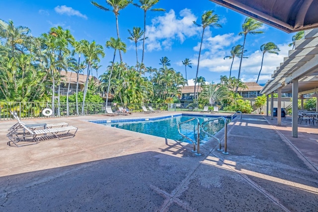 view of swimming pool featuring a pergola and a patio area