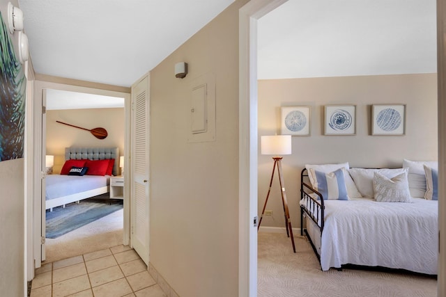 tiled bedroom with electric panel