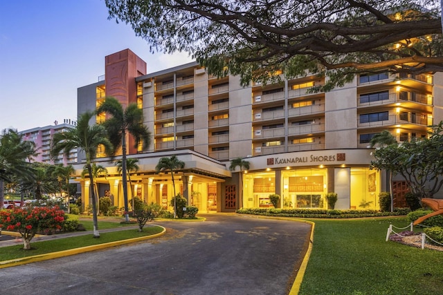 view of outdoor building at dusk