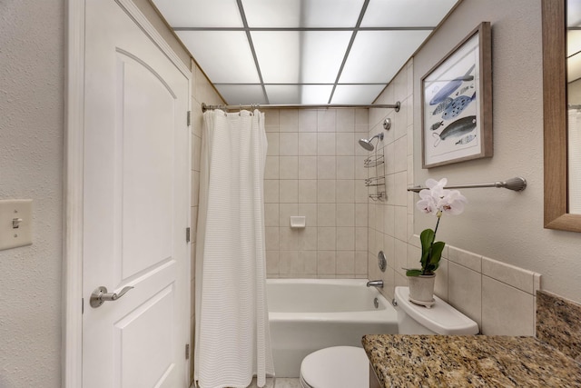 full bathroom with shower / bath combination with curtain, vanity, and toilet