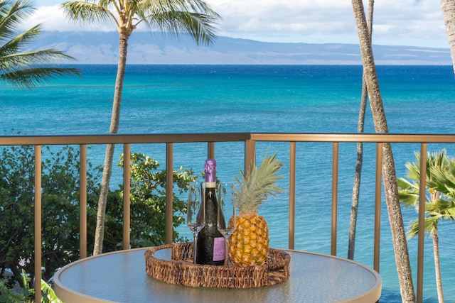 balcony featuring a water view