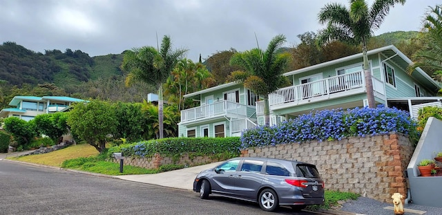 view of front of home featuring a balcony