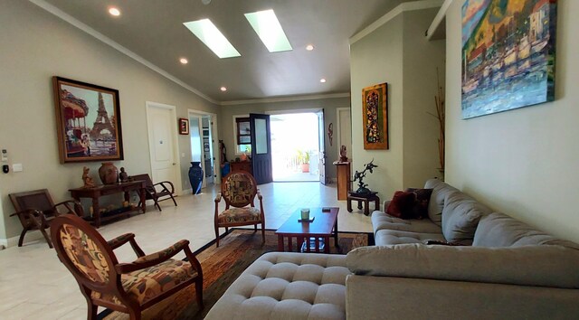 living room with lofted ceiling with skylight and ornamental molding