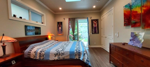 bedroom with hardwood / wood-style floors and ornamental molding