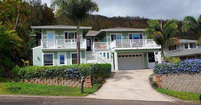 516 Polulani Dr, Wailuku, HI 96793 - view of front of home with stairway, driveway, a garage, and a balcony