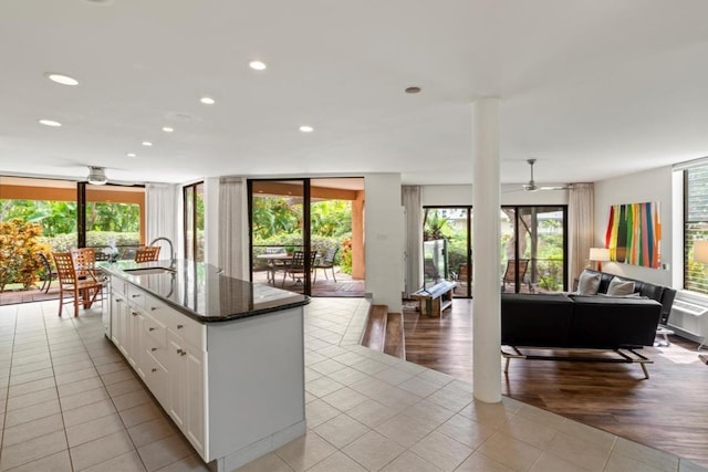 3300 Wailea Alanui St Unit 3A, Kihei, HI 96753 - kitchen featuring open floor plan, a sink, light tile patterned flooring, white cabinetry, and recessed lighting