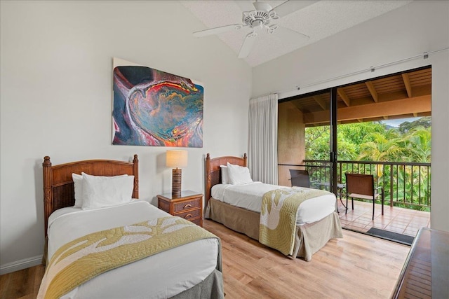 3300 Wailea Alanui St Unit 3A, Kihei, HI 96753 - bedroom featuring access to outside, wood finished floors, vaulted ceiling, and a ceiling fan