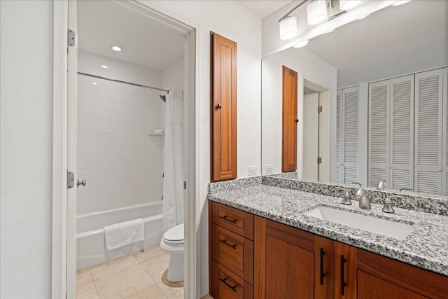 3300 Wailea Alanui St Unit 3A, Kihei, HI 96753 - bathroom with toilet, vanity, tile patterned flooring, shower / bathtub combination with curtain, and a closet