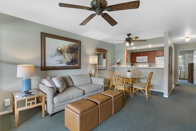 living room with ceiling fan and dark carpet