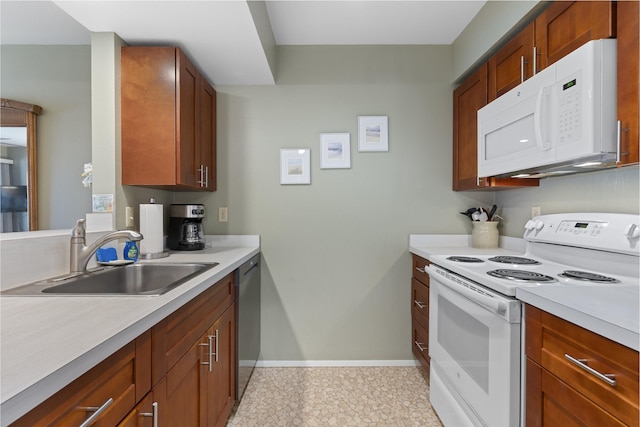 kitchen featuring white appliances and sink